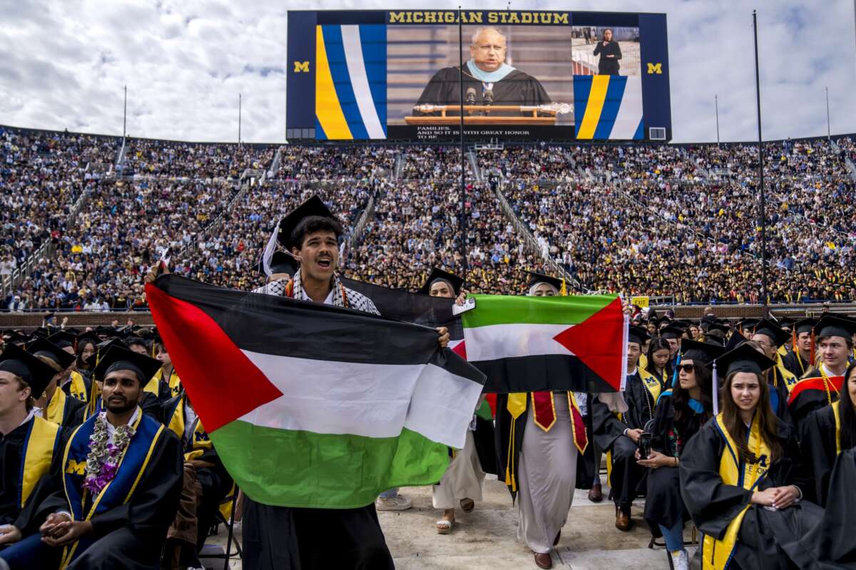 Students protest in support of Palestine during the University of Michigan’s Spring Commencement ceremony on May 4, 2024 at Michigan Stadium in Ann Arbor, Michigan.