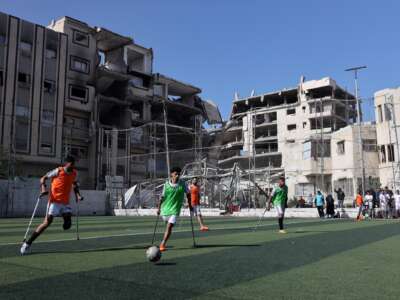 Palestinian amputee soccer players train amid the rubble of destroyed buildings in Gaza City, Palestine, on February 11, 2026.