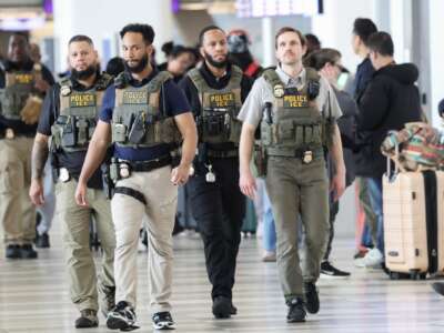 Federal law enforcement agents, including some with US Immigration and Customs Enforcement (ICE), walk through LaGuardia Airport in New York, on March 23, 2026.