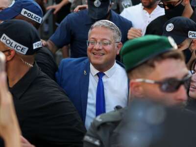 Israel's National Security Minister Itamar Ben Gvir takes part in the Jerusalem Day parade at the Damascus Gate in the old city of Jerusalem on May 14, 2026. Every year, thousands of Israeli nationalists march through Jerusalem and its occupied Old City, including in predominantly Palestinian neighborhoods, waving Israeli flags and shouting inflammatory slogans. Ben Gvir is shown wearing his noose pin celebrating Israel's new death penalty law against Palestinians.