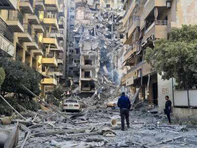 People look at the damages at the site of an Israeli strike in Tyre, southern Lebanon, on May 28, 2026. The Israeli military said on May 28 it had begun new strikes around the southern Lebanese city of Tyre after issuing an evacuation warning to its residents.