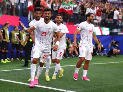 Ramin Rezaeian celebrates with teammates after scoring his team's first goal during the FIFA World Cup 2026 Group G match between Iran and New Zealand at Los Angeles Stadium on June 15, 2026 in Los Angeles, California.