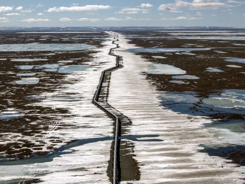 An oil pipeline stretches across the landscape outside Prudhoe Bay in North Slope Borough, Alaska, on May 25, 2019. The proposed Alaska LNG megaproject includes an 800-mile fossil gas pipeline running from the North Slope to a processing plant and export terminal in the Cook Inlet that would damage permafrost and disrupt caribou migration routes.