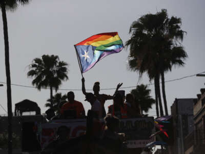 Revelers celebrate on 7th Avenue during the Tampa Pride Parade in the Ybor City neighborhood on March 26, 2022, in Tampa, Florida. The Tampa Pride was held in the wake of the passage of Florida's controversial "Don't Say Gay" Bill.