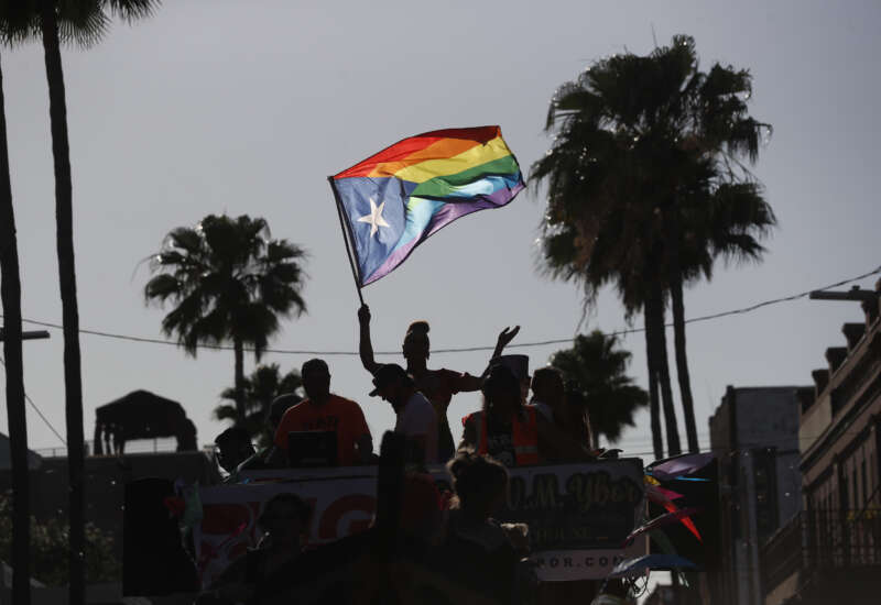 Revelers celebrate on 7th Avenue during the Tampa Pride Parade in the Ybor City neighborhood on March 26, 2022, in Tampa, Florida. The Tampa Pride was held in the wake of the passage of Florida's controversial "Don't Say Gay" Bill.