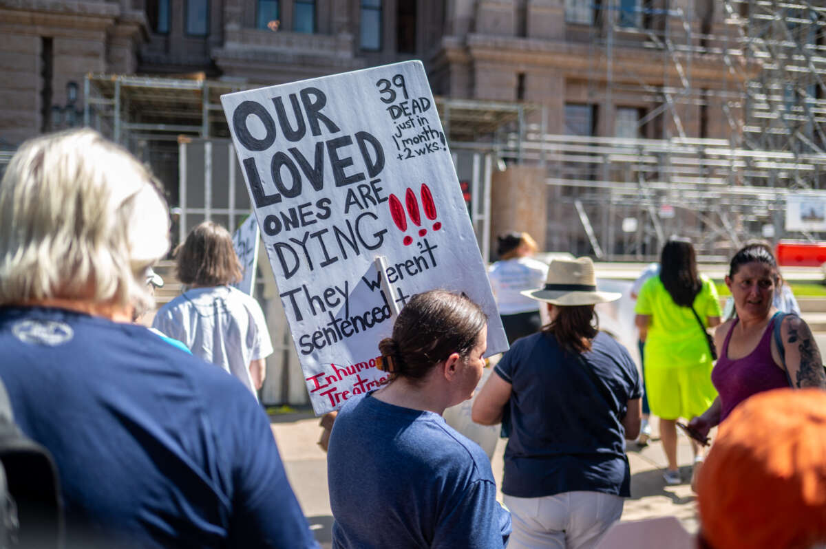 Demonstrators make their way into the Texas State Capitol building in Austin, Texas, on July 18, 2023. Activists visited the capitol to discuss the need for air conditioning in Texas state prisons, citing the harsh conditions and multiple deaths related to the heat and lack of relief from it.
