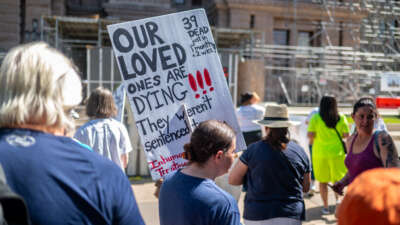Demonstrators make their way into the Texas State Capitol building in Austin, Texas, on July 18, 2023. Activists visited the capitol to discuss the need for air conditioning in Texas state prisons, citing the harsh conditions and multiple deaths related to the heat and lack of relief from it.