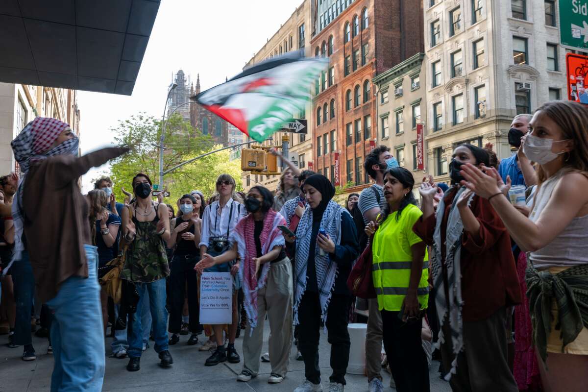 Pro-Palestinian protesters confront supporters of Israel outside The New School in lower Manhattan on May 2, 2024, in New York City.