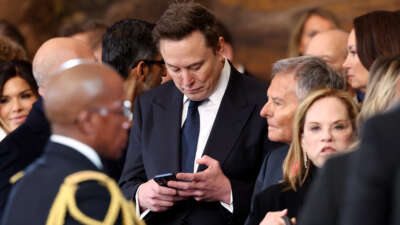 SpaceX, X, and Tesla CEO Elon Musk looks at his phone during the inauguration of Donald Trump as the 47th president of the United States in the Rotunda of the U.S. Capitol in Washington, D.C., on January 20, 2025.