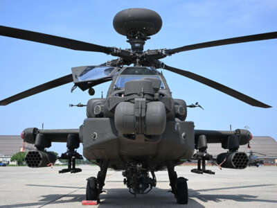 An AH-64 Apache helicopter is displayed ahead of the US Army's 250th anniversary, at Joint Base Andrews, Maryland, on June 12, 2025.