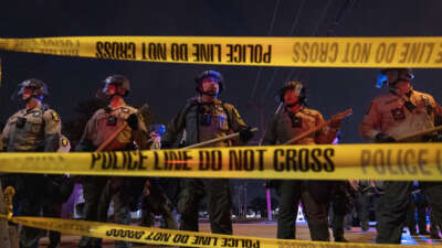 Police face off with demonstrators following the close of the "Free Speech Zone" near the immigration jail in Broadview, Illinois, on October 18, 2025.