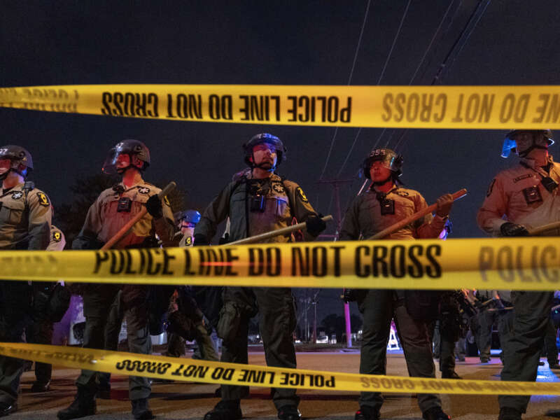 Police face off with demonstrators following the close of the "Free Speech Zone" near the immigration jail in Broadview, Illinois, on October 18, 2025.