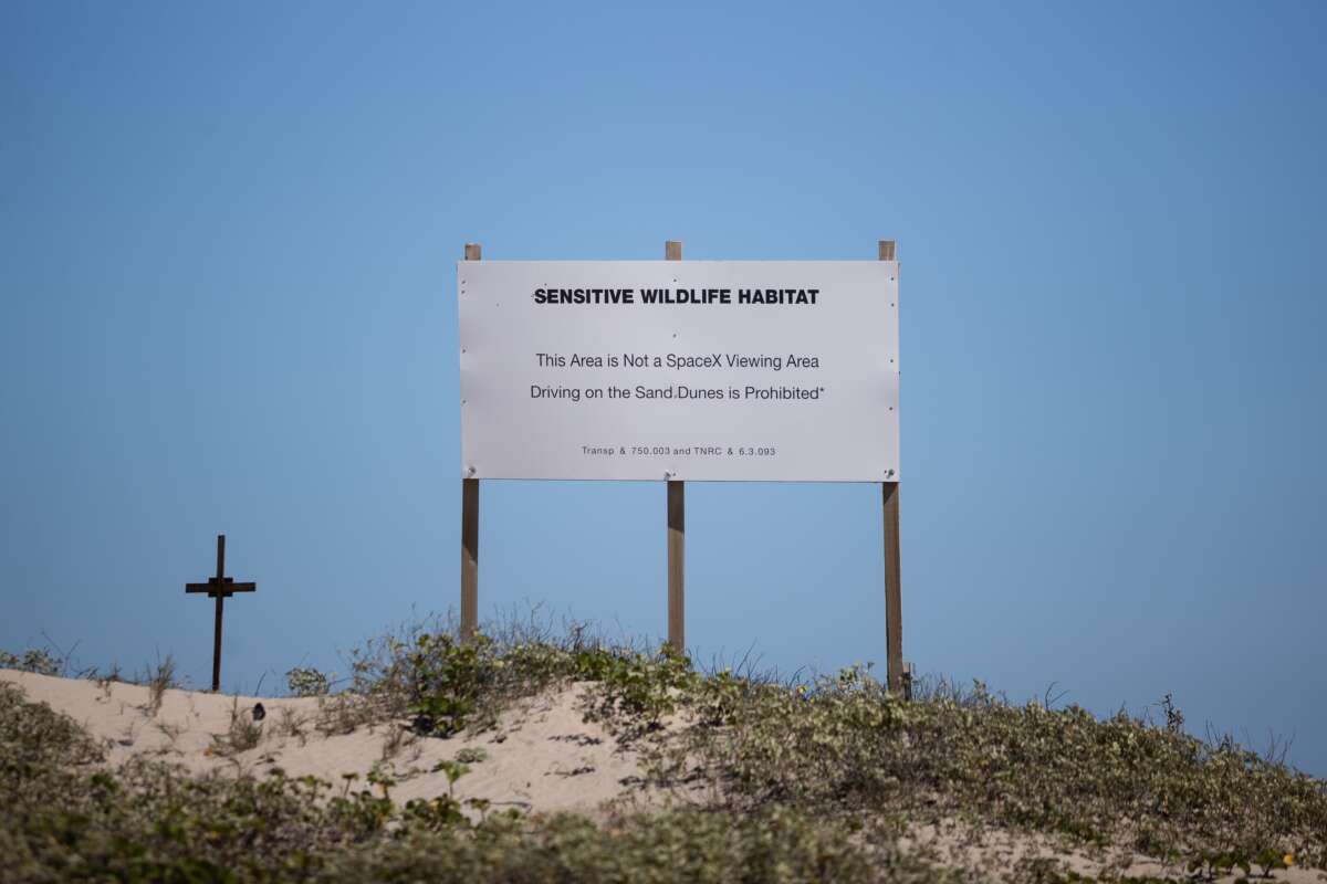 A sign warns SpaceX enthusiasts not to drive on a sensitive wildlife habitat, which sits directly across the street from the rocket launch site in Starbase, Texas, on February 6, 2026.