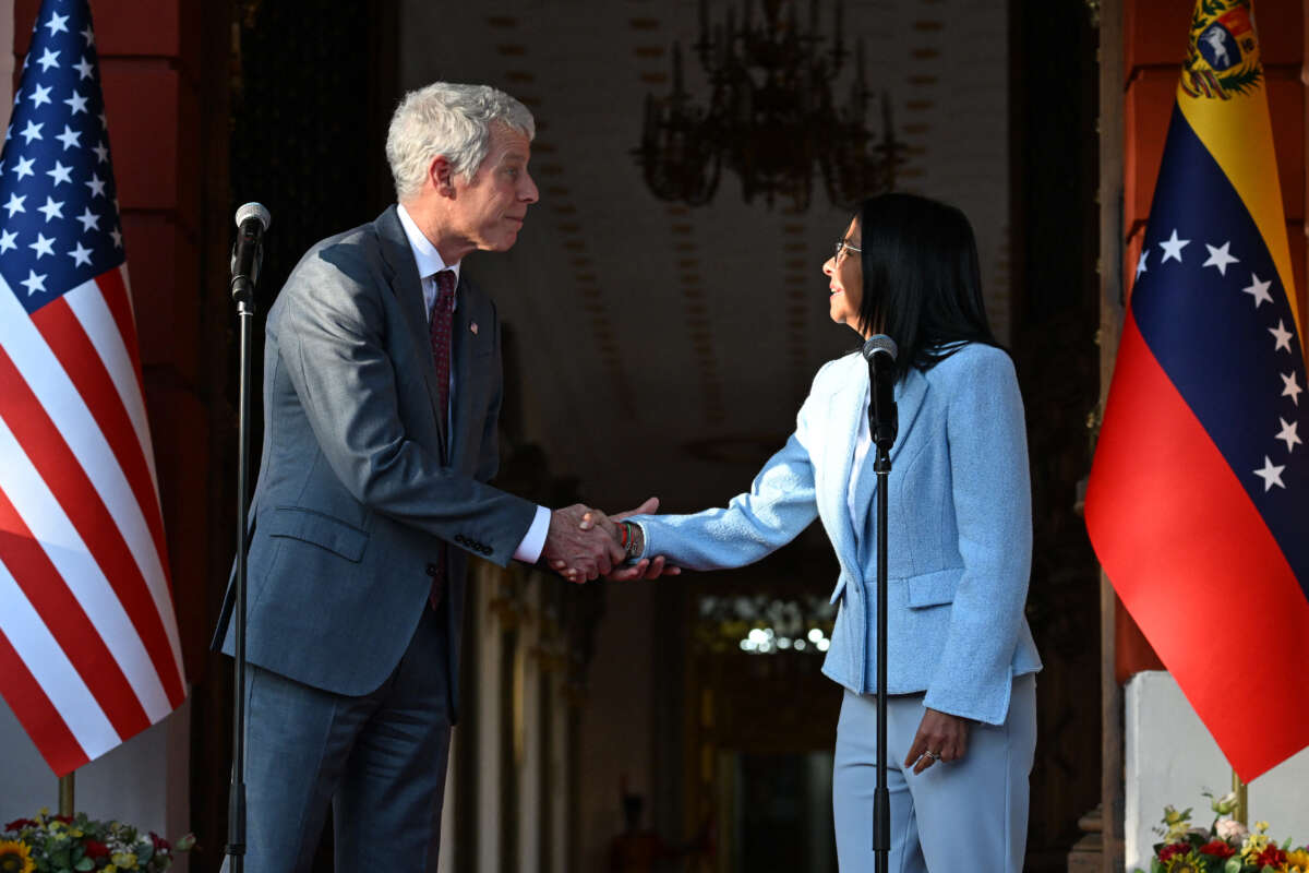 U.S. Secretary of Energy Chris Wright shakes hands with Venezuela's Acting President Delcy Rodriguez during a press conference after a meeting at the Miraflores Presidential Palace in Caracas, Venezuela, on February 11, 2026.