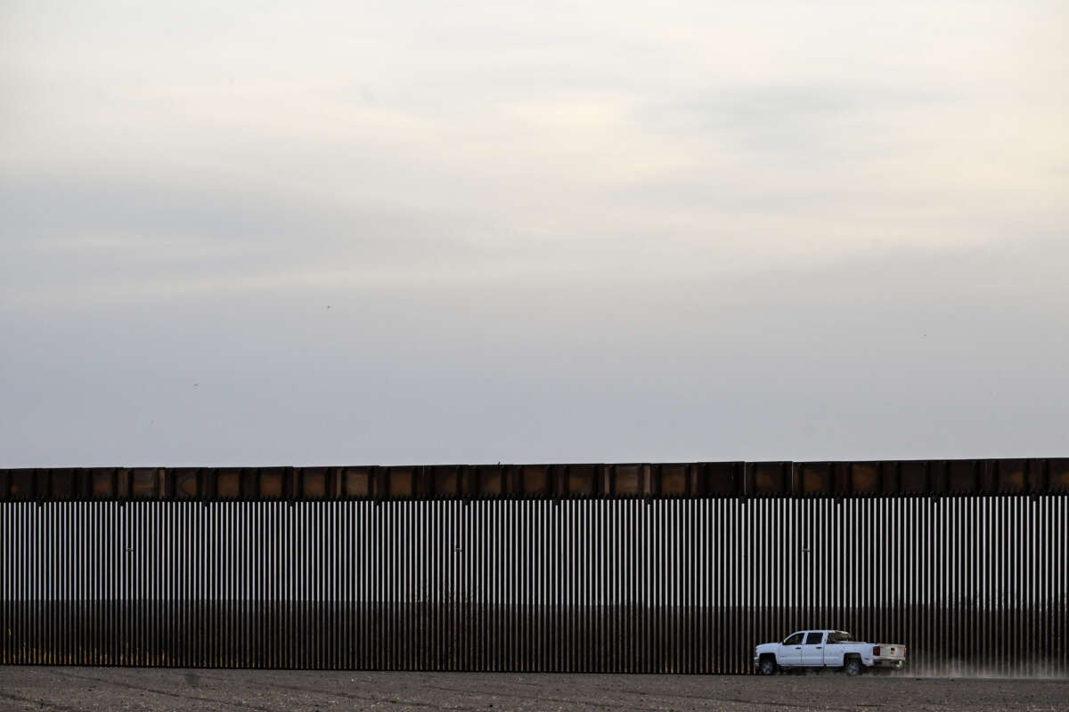 A truck rides along the U.S.-Mexico border wall in Quemado, Texas, on February 18, 2026.