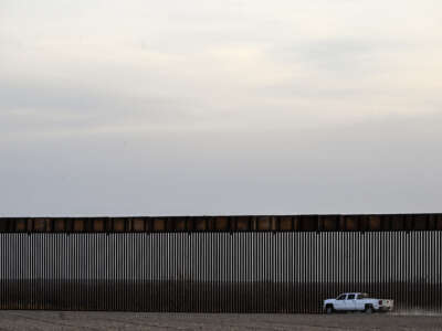 A truck rides along the U.S.-Mexico border wall in Quemado, Texas, on February 18, 2026.
