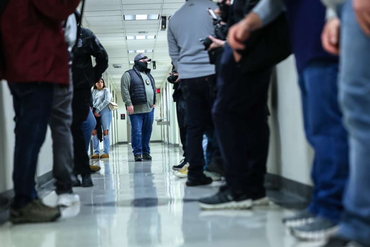 Federal agents patrol the halls of immigration court at the Jacob K. Javits Federal Building on March 4, 2026, in New York City.