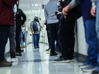 Federal agents patrol the halls of immigration court at the Jacob K. Javits Federal Building on March 4, 2026, in New York City.