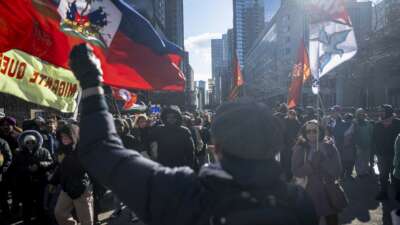 People march during a demonstration to denounce attacks on migrants and refugees on the International Day for the Elimination of Racial Discrimination in Montreal, Quebec, Canada, on March 21, 2026.