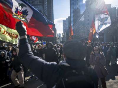 People march during a demonstration to denounce attacks on migrants and refugees on the International Day for the Elimination of Racial Discrimination in Montreal, Quebec, Canada, on March 21, 2026.