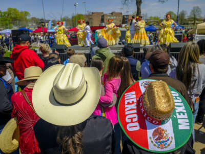 People watch a "Baile Folklorico" dance during the Cinco de Mayo parade in Saint Paul, Minnesota, on May 2, 2026. The Mexican community in the Minneapolis-Saint Paul area is celebrating its first Cinco de Mayo since Immigration and Customs Enforcement (ICE) conducted large operations in early 2026.