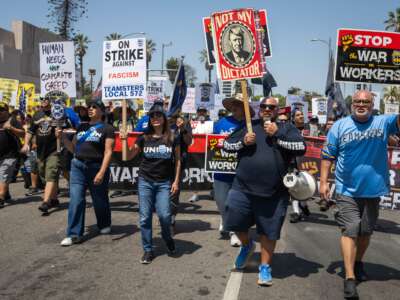 Teamsters march through downtown Los Angeles for a May Day rally on Friday, May 1, 2026.