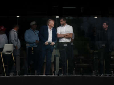 President Donald Trump attends a LIV Golf tournament with his son Erik Trump at Trump National Golf Club Washington, D.C., on May 9, 2026, in Sterling, Virginia.