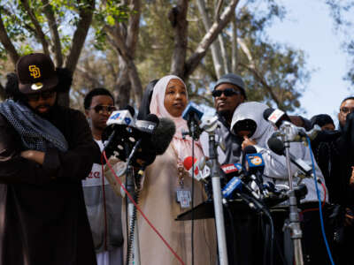 Hawaa Abdullah, the daughter of Amin Abdullah, the security guard who was shot and killed at the Islamic Center of San Diego, speaks during a press conference on the shooting at Lindbergh Park, near the mosque, in San Diego, California, on May 19, 2026.