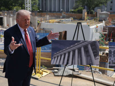 President Donald Trump talks to reporters about his proposed White House ballroom next to the worksite on May 19, 2026, in Washington, D.C.