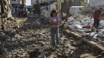 A Palestinian girl walks through the site of an overnight Israeli military strike on structures and tents housing displaced families, killing 10 Palestinians, in Gaza City, on May 28, 2026.