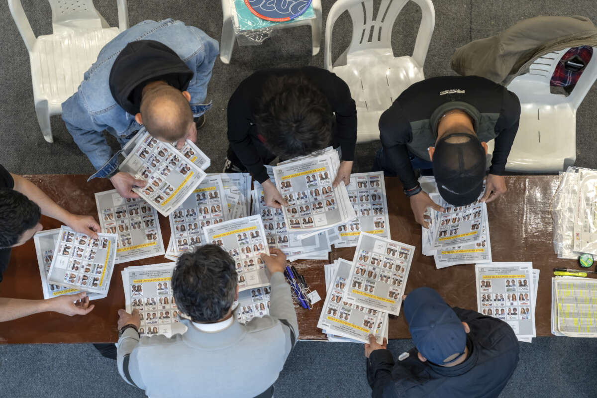 Election officials count the votes during the presidential election on May 31, 2026, in Bogota, Colombia.