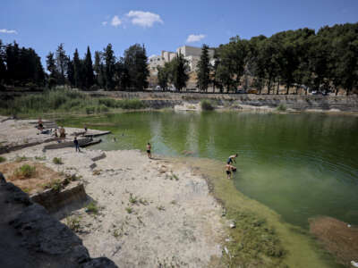 Palestinian visitors walk and play near the water at the ancient Solomon's Pools in Bethlehem, in the occupied West Bank, on May 31, 2026.