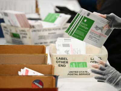 Election workers process mail-in ballots at the Los Angeles County Ballot Processing Center during California's state primary election in the City of Industry, California, on June 2, 2026.