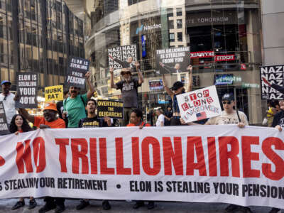 A small group of political activists protest against NASDAQ's plans next week to have an IPO of Elon Musk's Space X company, June 5, 2026, outside the NASDAQ exchange in Times Square, New York City.