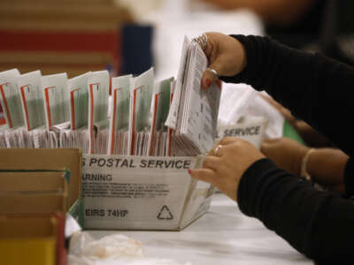 An election worker processes mail-in ballots for the California state primary election at the Los Angeles County Ballot Processing Center on June 5, 2026, in the City of Industry, California.