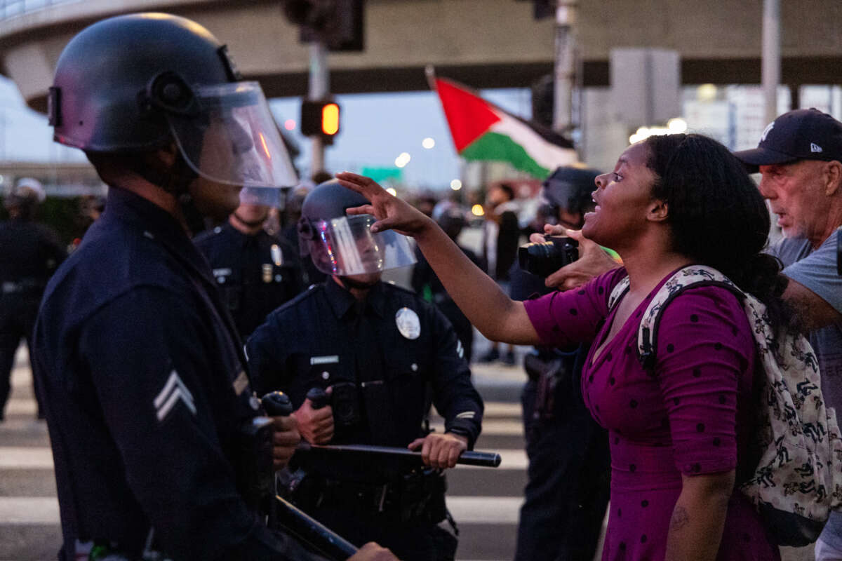 Anti-ICE demonstrators clash with police officers outside a federal detention center on June 6, 2026, in Los Angeles, California.