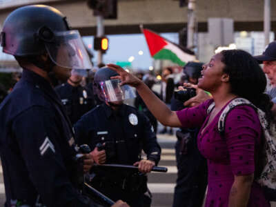 Anti-ICE demonstrators clash with police officers outside a federal detention center on June 6, 2026, in Los Angeles, California.