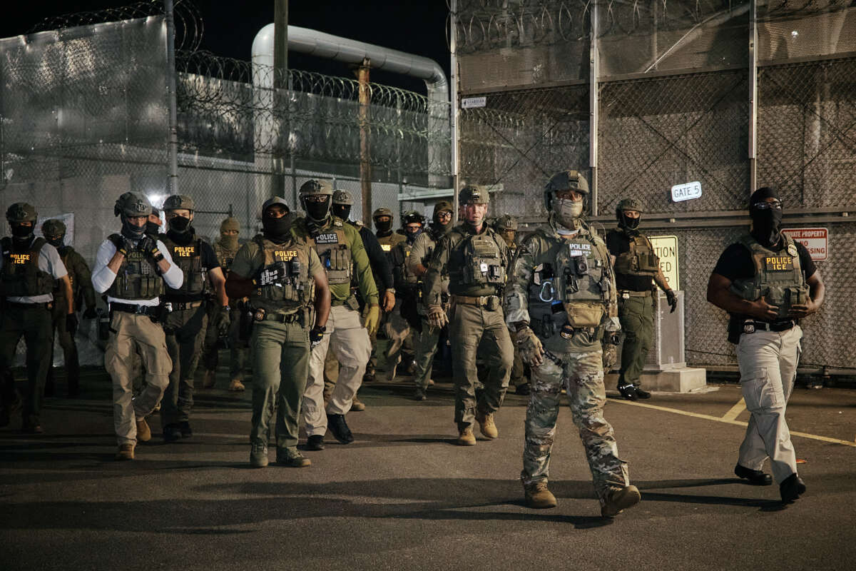 ICE agents arrive to clear protesters from a gate outside the Delaney Hall detention facility during a demonstration protesting the transfer of detainees and conditions inside the facility on June 11, 2026, in Newark, New Jersey.