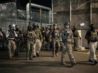 ICE agents arrive to clear protesters from a gate outside the Delaney Hall detention facility during a demonstration protesting the transfer of detainees and conditions inside the facility on June 11, 2026, in Newark, New Jersey.