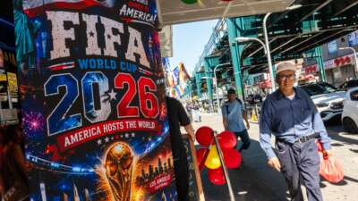 Businesses along Roosevelt Avenue prepare for the World Cup by displaying flags, soccer jerseys, and banners on June 9, 2026, in the Queens borough of New York City.