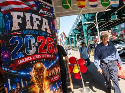 Businesses along Roosevelt Avenue prepare for the World Cup by displaying flags, soccer jerseys, and banners on June 9, 2026, in the Queens borough of New York City.