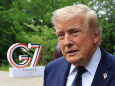 President Donald Trump arrives to attend a musical interlude before a gala dinner as part of the G7 summit, in Evian, France, on June 16, 2026.