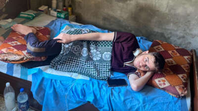Mohammed Afaneh lying in bed, unable to move.