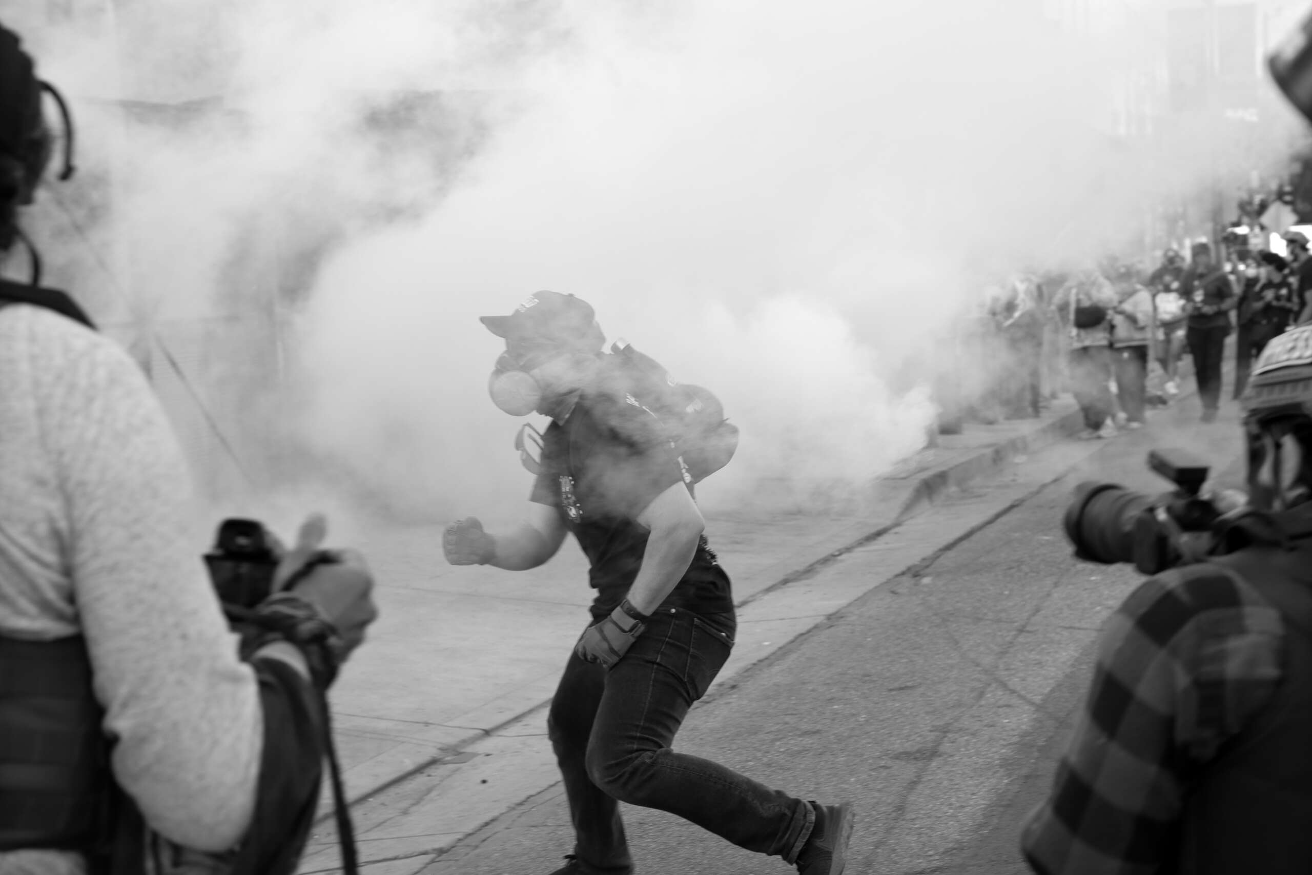 Human rights experts condemn the increasing use of weapons like tear gas, pepper balls, and rubber bullets.
