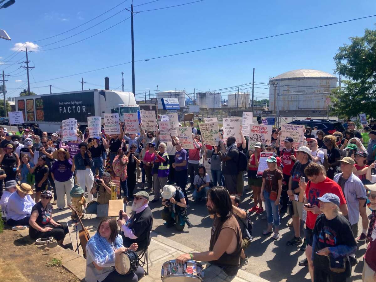 Labor activists listen to speeches at a rally outside of Delaney Hall immigrant jail. The Father's Day rally was organized by Labor Eyes on ICE on June 21, 2026.