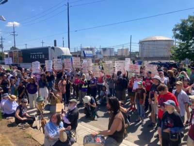 Labor activists listen to speeches at a rally outside of Delaney Hall immigrant jail. The Father's Day rally was organized by Labor Eyes on ICE on June 21, 2026.