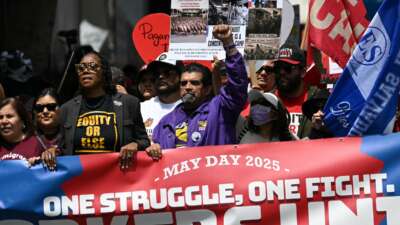 Protestors demonstrate during a May Day Workers Unite! march in Los Angeles, California, on May 1, 2025.