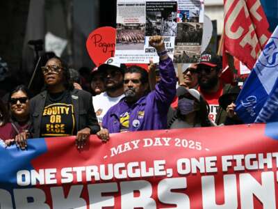 Protestors demonstrate during a May Day Workers Unite! march in Los Angeles, California, on May 1, 2025.