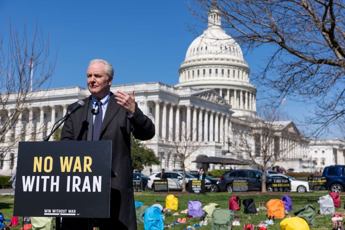 Sen. Chris Van Hollen (D-Maryland) speaks on Capitol Grounds in front of a memorial of 168 pairs of shoes representing those killed in the U.S. strike on an Iranian school, on March 18, 2026 in Washington, D.C.