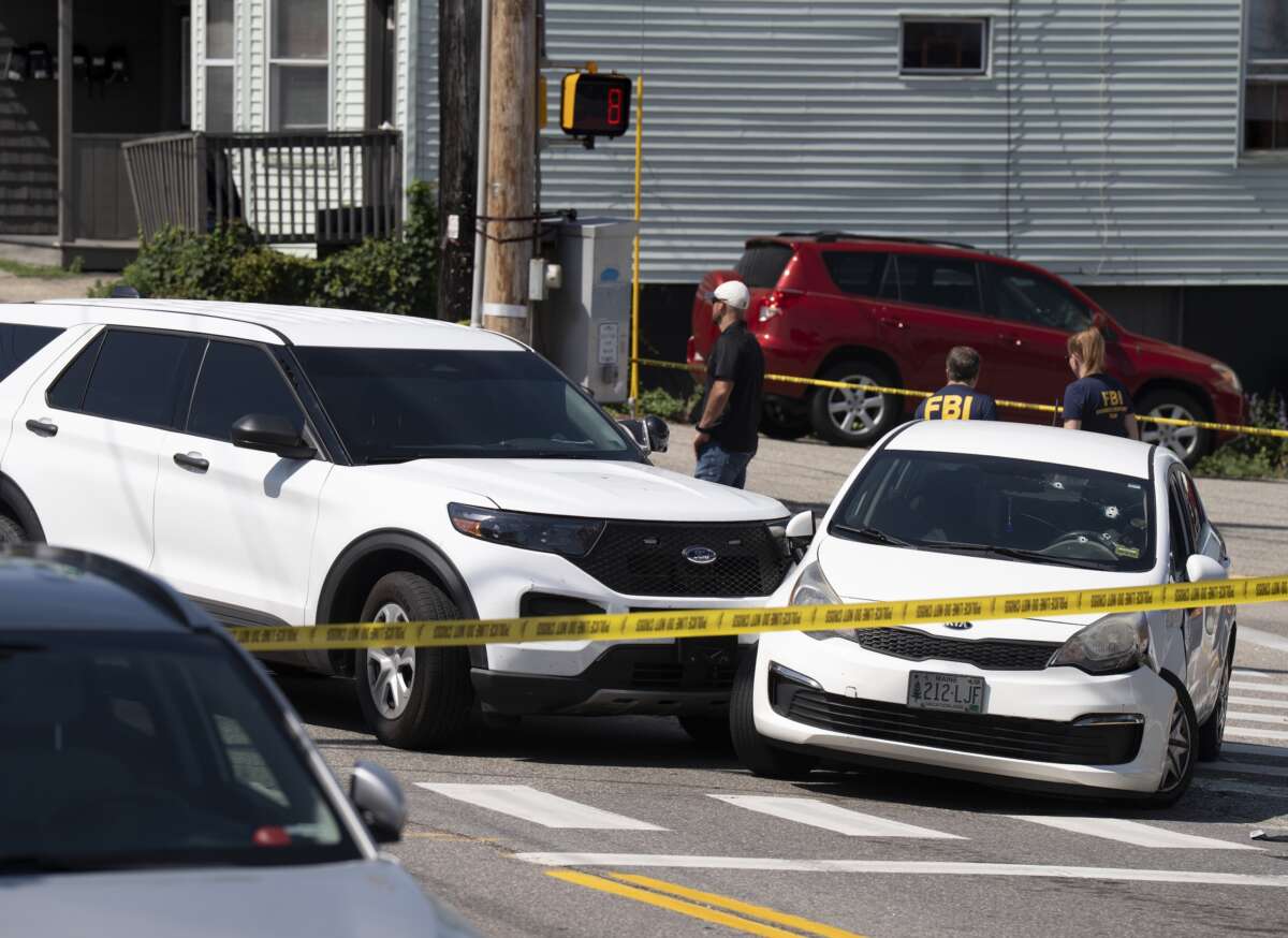 A Kia sedan reportedly driven by the victim of a fatal shooting can be seen with four bullet holes in the windshield at the scene on Pool Street in Biddeford on Monday, July 13, 2026.